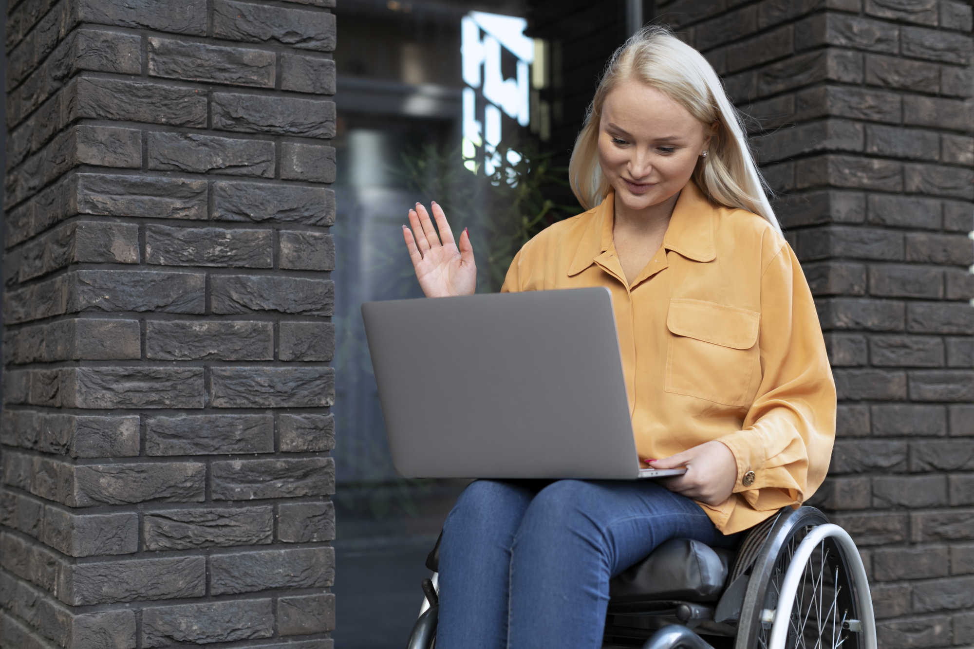 disabled person wheelchair working laptop